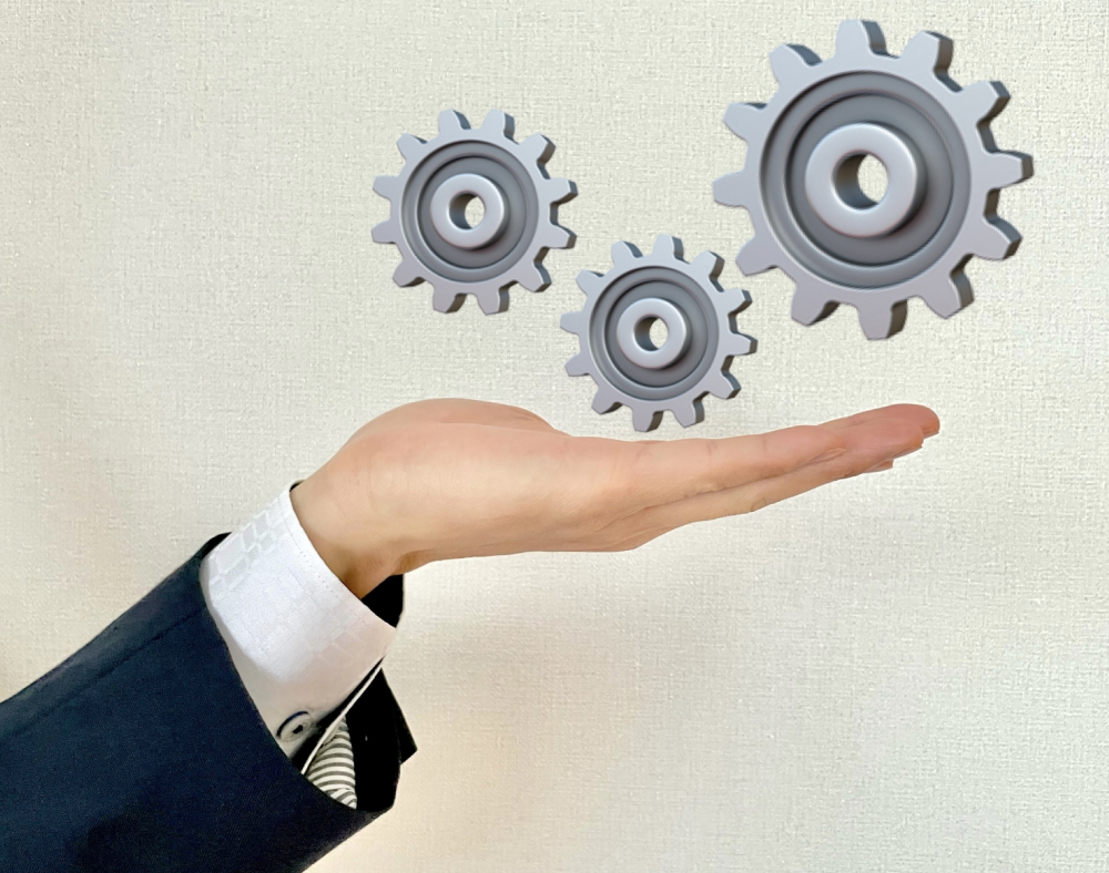 手と歯車の画像